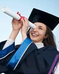 Girl in Convocation Gowns watching through degee rool